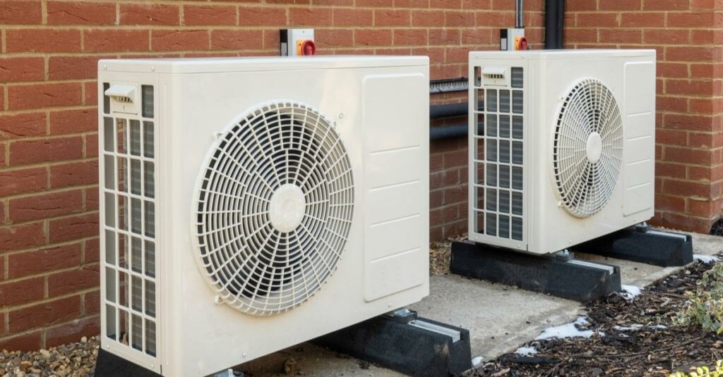 air source heat pumps installed on the exterior of a modern house cost